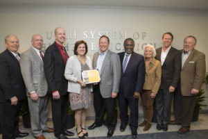 Several members of the Promise Partnership Regional Council pose with Ralph Smith following his presentation in March. 
