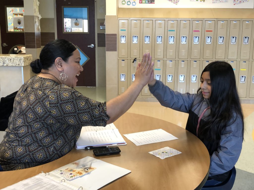 Savage Volunteer high 5s Midvale student