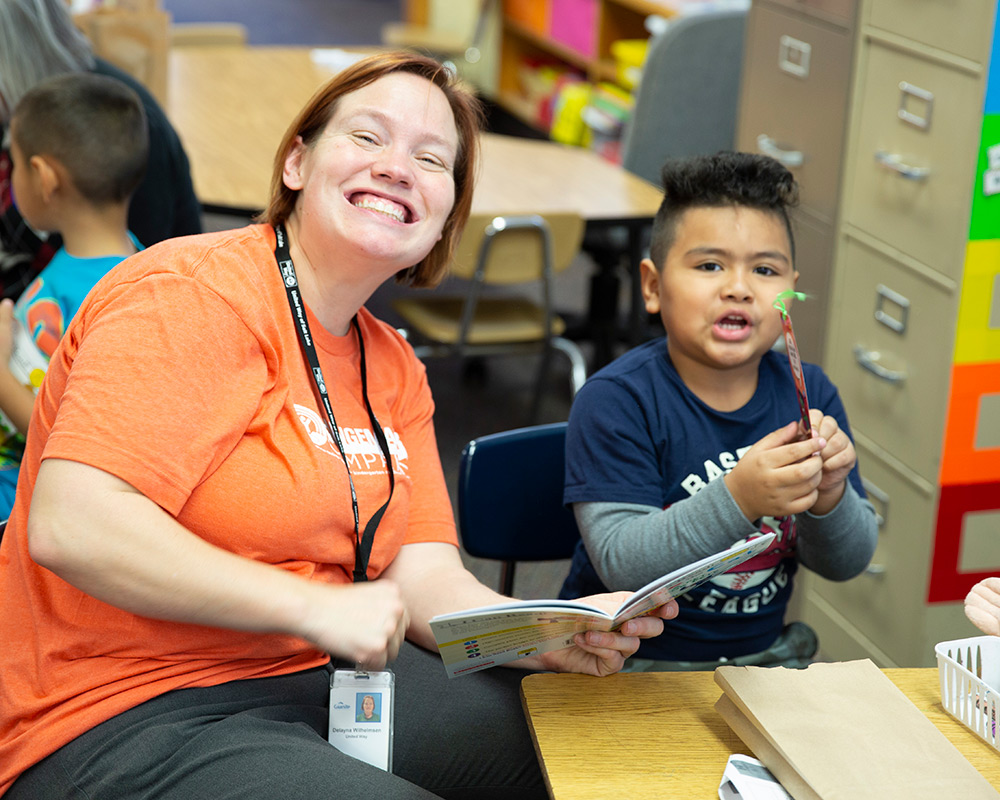 Community School Director, DeLayna, reading to kids at West Kearns