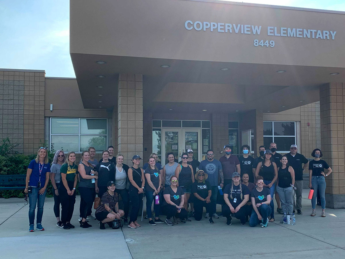 CHG Volunteers pose outside Copperview Elementary