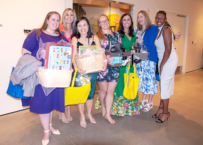 Women with their prize baskets at Power of Your Purse