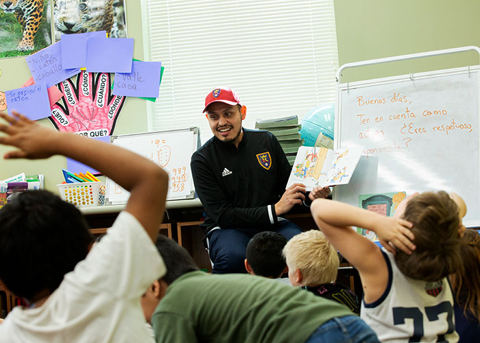 Real Salt Lake player reads book to group of kids
