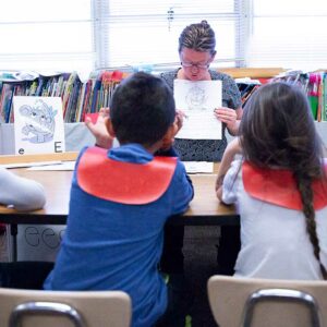 preschool students look at teacher