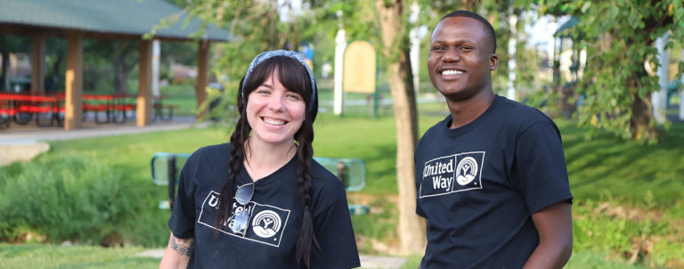year in review hero- two staff members smiling in live united shirts